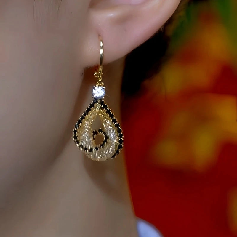Model showcasing the dangle and style of the 14K Gold-Plated  Zircon Mesh Water Drop Earrings