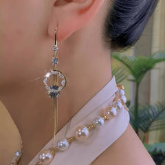 Model showcasing the dangle and style of the 14K Gold-Plated Zircon Moon Ear Hook Earrings