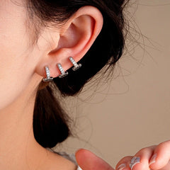 Model showcasing the dangle and style of the 14K Gold-Plated Zircon Multi-Layer Ear Clip Earrings ( 1 Pair )