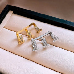 Close-up detail of the sparkling zircons and plating on the Golden Layered Cuffs