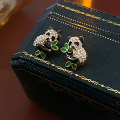 Model showcasing the dangle and style of the 14K Gold-Plated Zircon Panda Stud Earrings