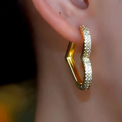 Close-up detail of the sparkling zircons and plating on the Peach Heart Drops