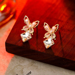 Close-up detail of the sparkling zircons and plating on the Butterfly Cube Earrings