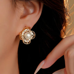 Model showcasing the dangle and style of the 14K Gold-Plated Zircon Pearl Flower Stud Earrings