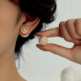 White Pearl Gold CZ Sunburst Double-Sided Stud Earrings Worn on Ear