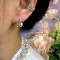 Close-up detail of the sparkling zircons and plating on the Little Hoop Earrings