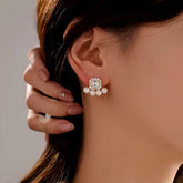 Silver-tone square crystal pearl stud earring worn on a woman's ear