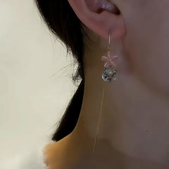 Close-up detail of the sparkling zircons and plating on the Flower Threader Earrings