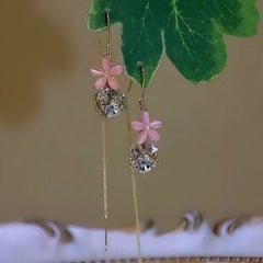 Angled view of the 14K Gold-Plated Zircon Pink Flower Zircon Ball Threader Earrings