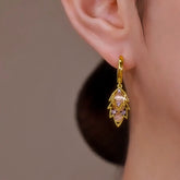 Gold Leaf Dangle Hoop Earring with Pink Opal & Purple Crystals on Woman's Ear