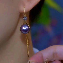 Close-up detail of the sparkling zircons and plating on the Threader Earrings