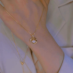 14K Gold-Plated Zircon Shell-Shaped Dynamic Circle Necklaces worn to showcase its length and pendant detail