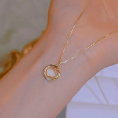 Close-up of the pendant and clasp on the Circle Necklaces