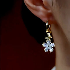 Close-up detail of the sparkling zircons and plating on the Small Flower Earrings