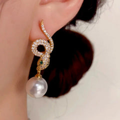 Close-up detail of the sparkling zircons and plating on the Snake Pearl Earrings