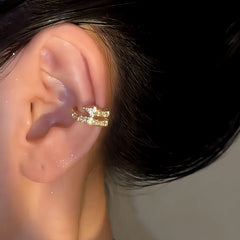 Gold pave star ear cuff on ear, side angle closeup view
