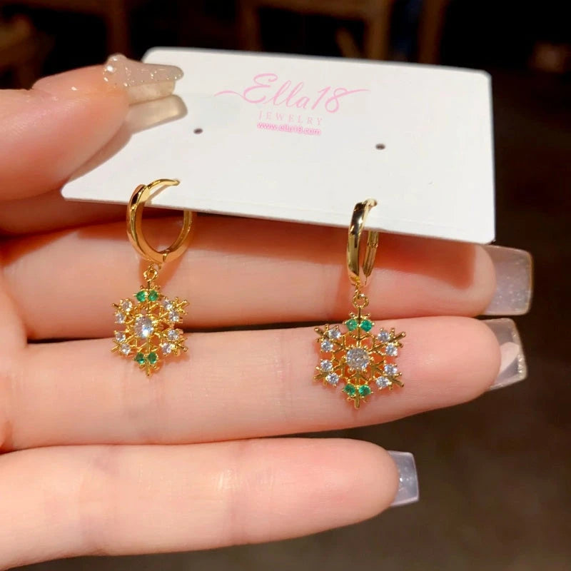Angled view of the 14K Gold-Plated Christmas Zircon Snowflake Earrings