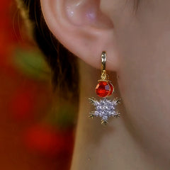 Model showcasing the dangle and style of the 14K Gold-Plated Zircon Snowflake Tassel Earrings