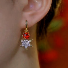 Close-up detail of the sparkling zircons and plating on the Snowflake Tassel Earrings