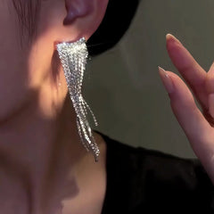 Close-up detail of the sparkling zircons and plating on the Tassel Earrings