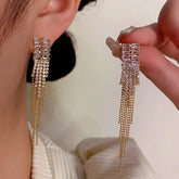 Gold Crystal Long Tassel Dangle Earrings, Worn & Held Close-up