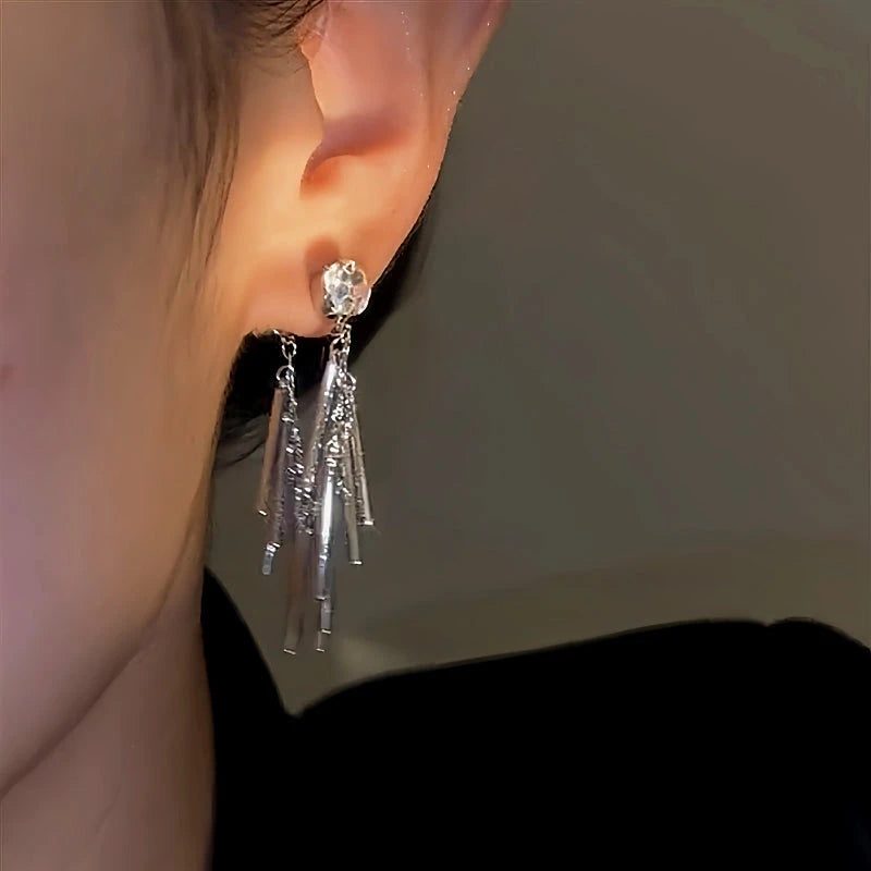 Close-up detail of the sparkling zircons and plating on the Tassel Earrings