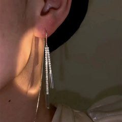 Model showcasing the dangle and style of the 14K Gold-Plated Zircon Threader Earrings
