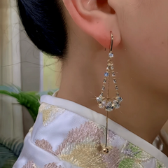 Close-up detail of the sparkling zircons and plating on the Tassel Earrings