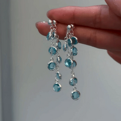 Angled view of the 14K Gold-Plated Zircon Water Drop Tassel Earrings