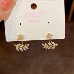 Close-up detail of the sparkling zircons and plating on the Wheat Jacket Earrings
