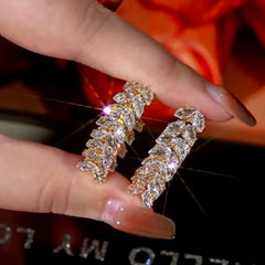 Angled view of the 14K Gold-Plated Zircon Wheat Earrings