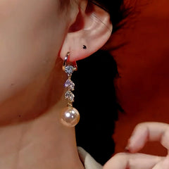 Close-up detail of the sparkling zircons and plating on the Pearl Earrings