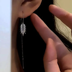 Model showcasing the dangle and style of the 14K Gold-Plated Zircon Wheat Threader Earrings