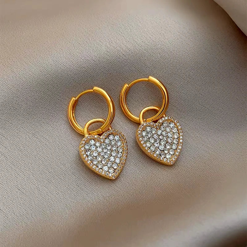 Close-up detail of the sparkling zircons and plating on the Gold Heart Earrings