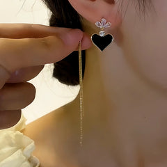 Close-up detail of the sparkling zircons and plating on the Heart Tassel Earrings