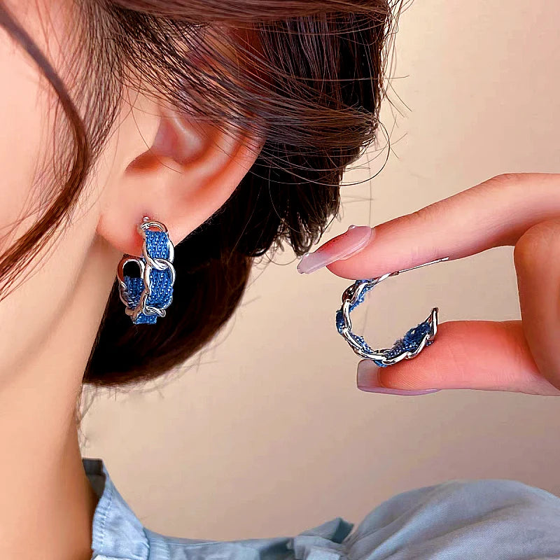 Angled view of the 14K Gold-plated Blue C-Shaped Earrings