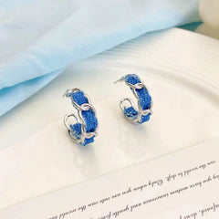 Close-up detail of the sparkling zircons and plating on the Blue C-Shaped Earrings