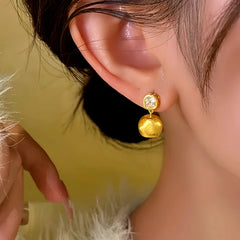 Close-up detail of the sparkling zircons and plating on the Square Earrings