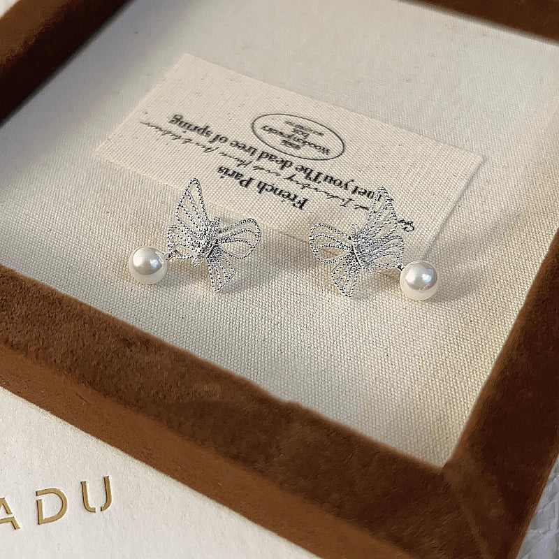 Angled view of the 14K Gold-plated Butterfly Bead Earrings