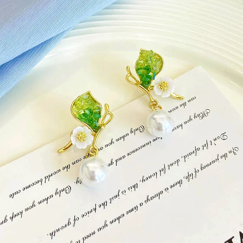 Angled view of the 14K Gold-plated Butterfly Pearl Earrings