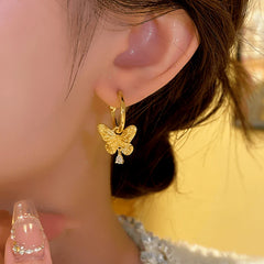Close-up detail of the sparkling zircons and plating on the Butterfly Pendant Earrings