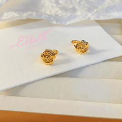 Angled view of the 14K Gold-plated Camellia Small Hoop Earrings