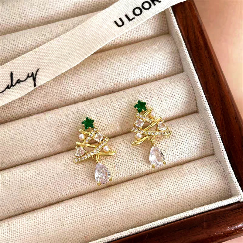 Angled view of the 14K Gold-plated Christmas Diamond Tree Earrings