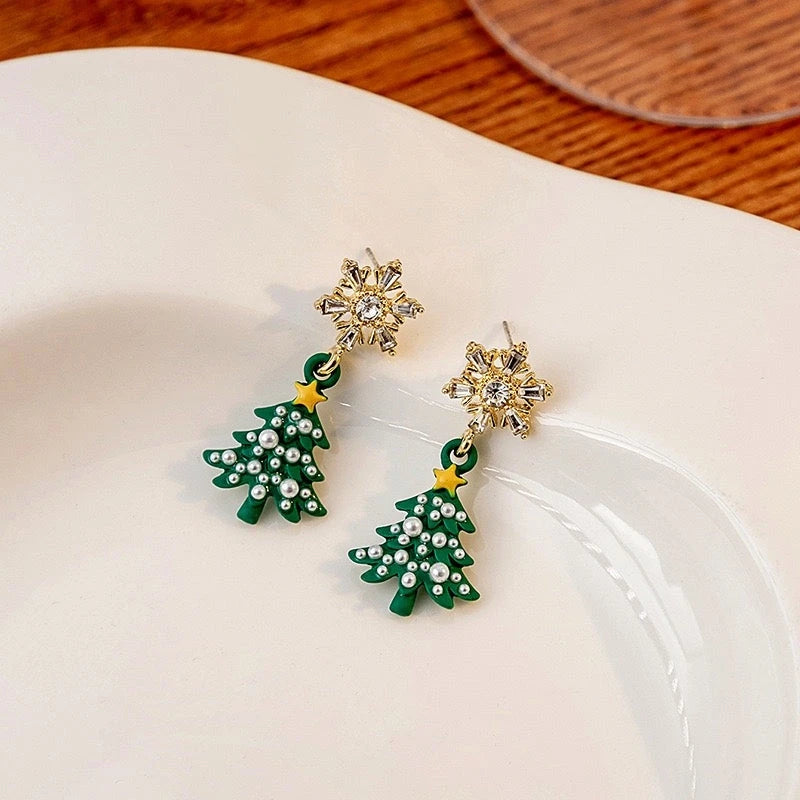 Angled view of the 14K Gold-plated Christmas Diamond Zircon Snowflake Christmas Tree Earrings