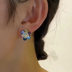 Model showcasing the dangle and style of the 14K Gold-plated Colorful Crystal Stud Earrings
