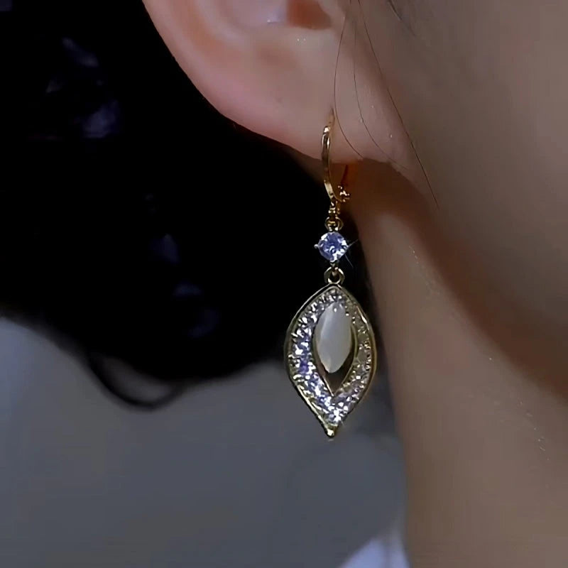 Close-up detail of the sparkling zircons and plating on the Cat's Eye Leaf Earrings