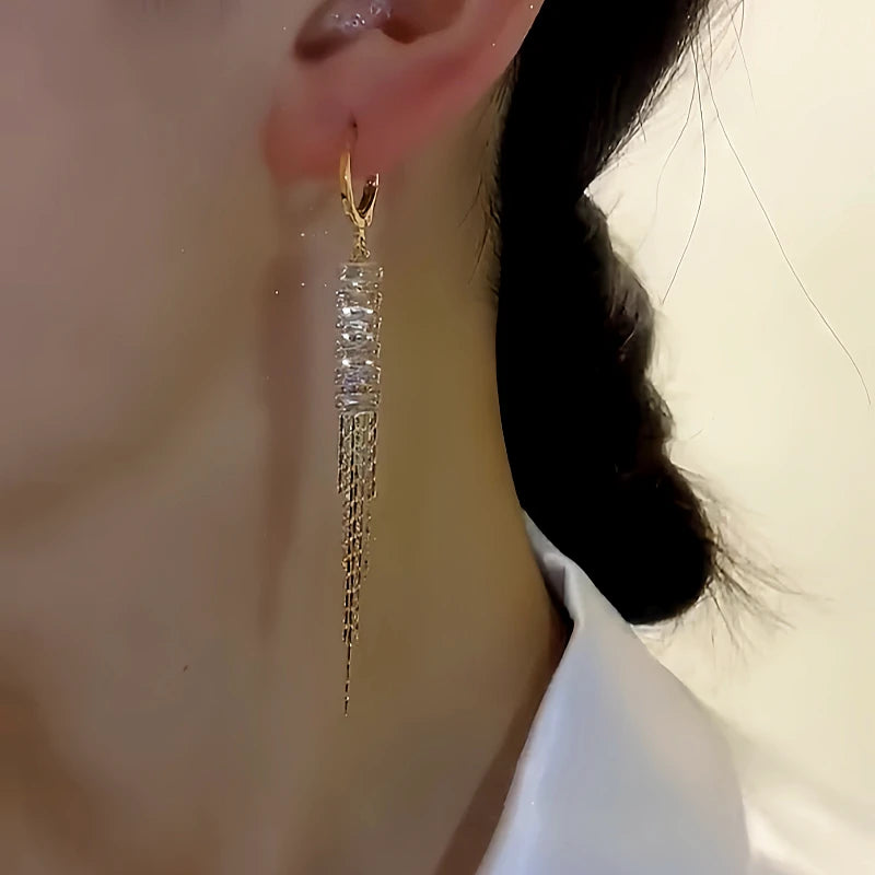 Close-up detail of the sparkling zircons and plating on the Gold Tassel Earrings