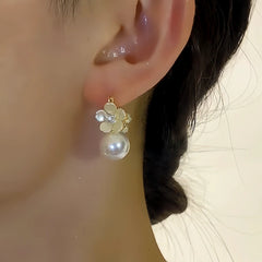 Close-up detail of the sparkling zircons and plating on the Shell Flower Earrings