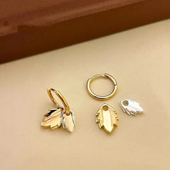 Close-up detail of the sparkling zircons and plating on the Double Leaf Earrings