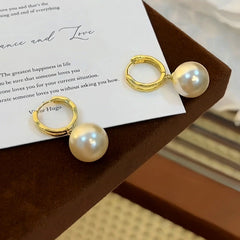 Close-up detail of the sparkling zircons and plating on the Pearl Earrings